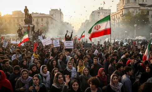 Large crowd of protesters holding Iranian flags and signs during a demonstration